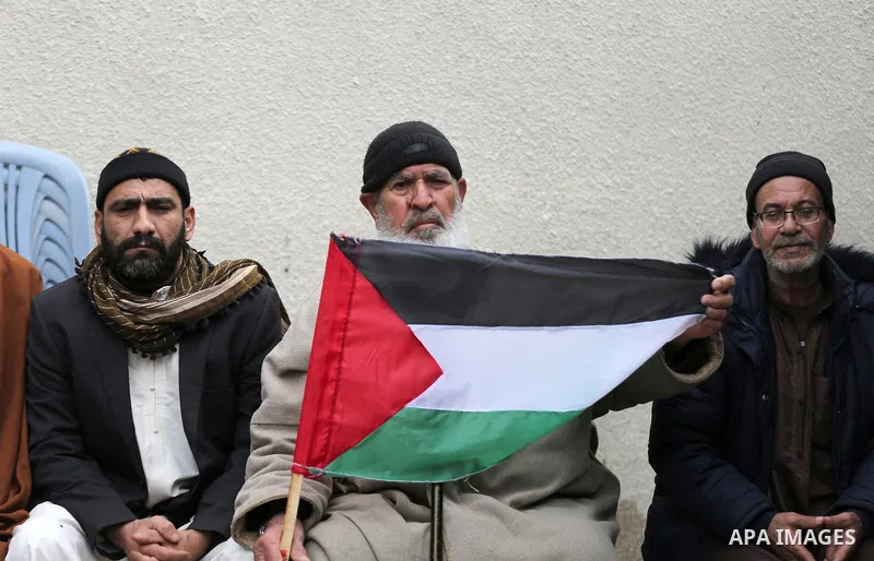 Palestinians of Social Affairs take part in a protest to demand the payment of their allowances, in front of United Nations Development Programme office (UNDP) in Gaza city on March 3, 2022. Photo by Salam Yasser