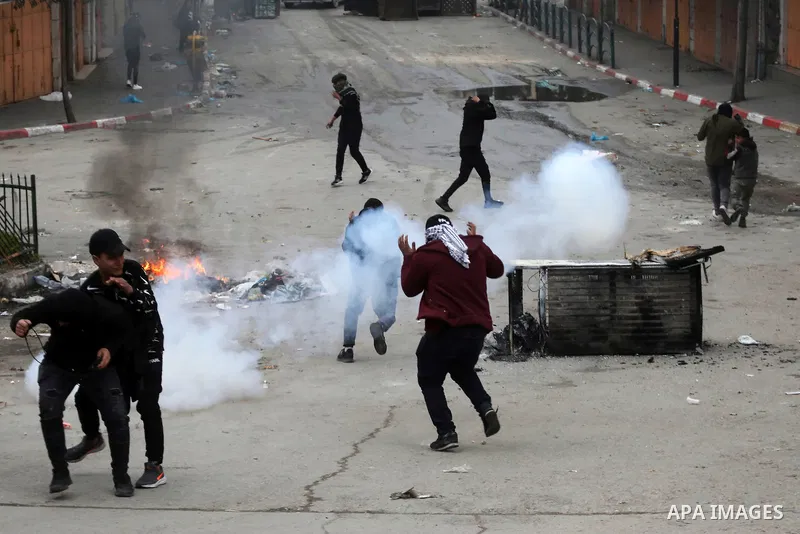 Palestinian protesters clash with Israeli security forces against the expansion of Jewish settlements in the West Bank city of Hebron on March 4, 2022. Photo by Mamoun Wazwaz