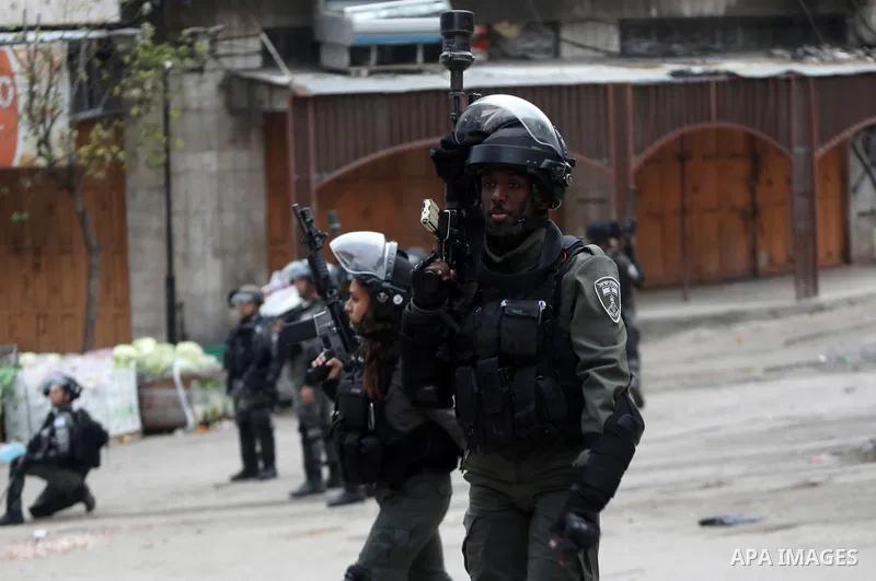Palestinian protesters clash with Israeli security forces against the expansion of Jewish settlements in the West Bank city of Hebron on March 4, 2022. Photo by Mamoun Wazwaz