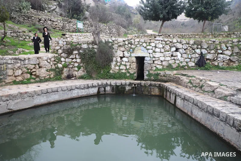 Jewish settlers visit the abandoned buildings in village of Lifta on the western edge of Jerusalem on March 6, 2022. The village of Lifta, which lies just outside Jerusalem, has been abandoned since the Israeli army drov...