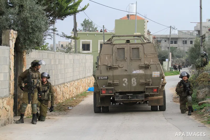 Israeli security forces stand guard during a demolition operation in the village of Silat al-Harithiya near the West Bank city of jenin, on March 8, 2022. Israel's army said on December 19, 2021 that they had arrested fo...