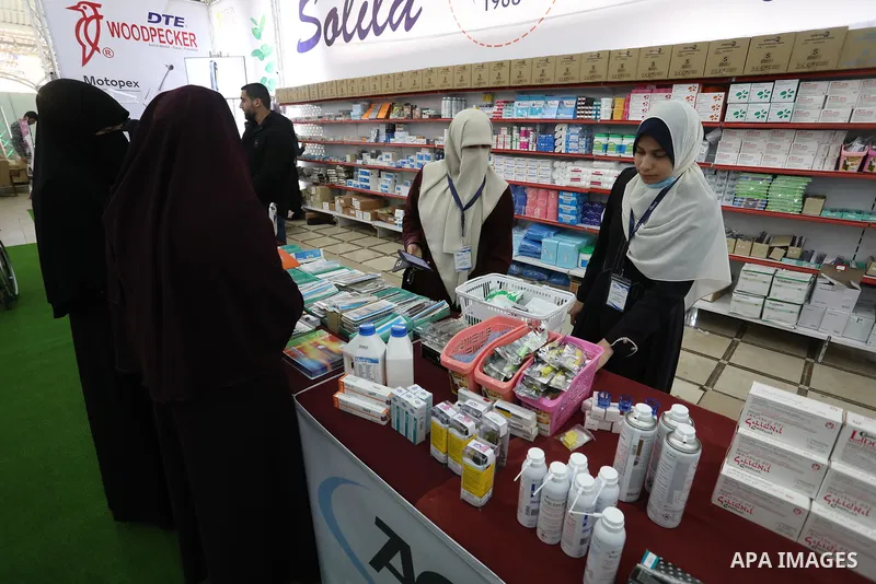 Palestinians attend a dental exhibition, in Gaza city on March 10, 2022. Photo by Ashraf Amra