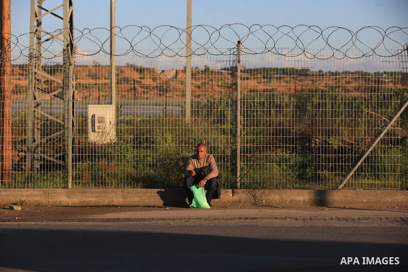 Palestinian workers wait at the Erez crossing as they prepare to leave Beit Hanun in the northern Gaza Strip, to go to work inside Israel, on March 13, 2022. Israel is set to issue another 2,000 work permits for Palestin...