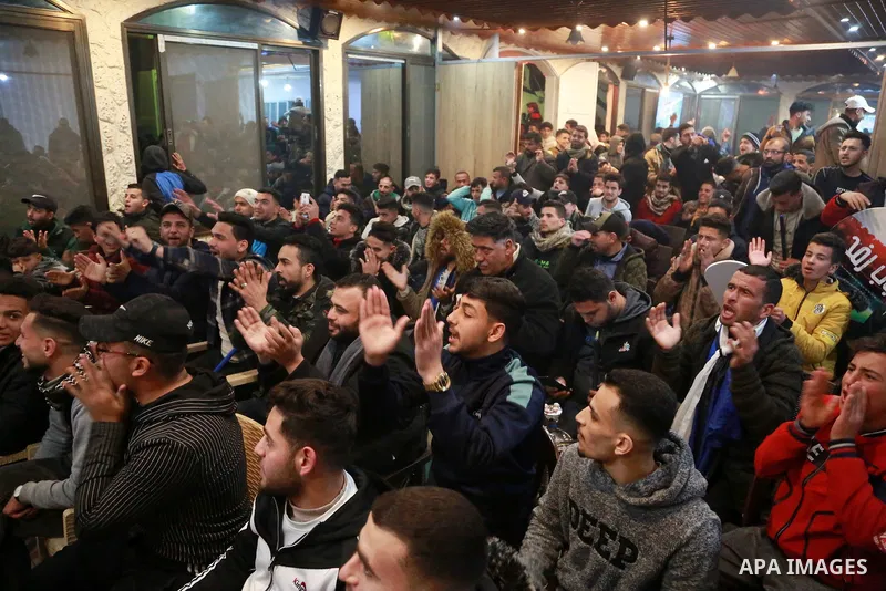 Palestinians watch the Shabab Rafah v Shabab Hebron during a match of Al-Quds and Al-Karama League, in Rafah in the southen of Gaza strip on March 21, 2022. Photo by Bashar Taleb