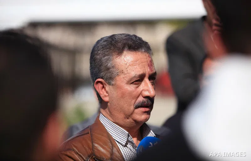 The Father of Palestinian Diaa Hamarshah who carried out a shooting attack in a Tel Aviv suburb, stands outside his house during a patrol by Israeli soldiers in the West Bank city of Jenin on March 30, 2022. Photo by Ahm...