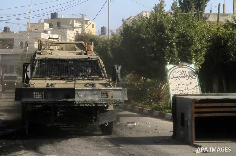 Israeli soldiers patrol reportedly from where Palestinian Diaa Hamarshah left before killing five Israeli settlers during a gun attack in Israel in the West Bank city of Jenin on March 30, 2022. Photo by Ahmed Ibrahim