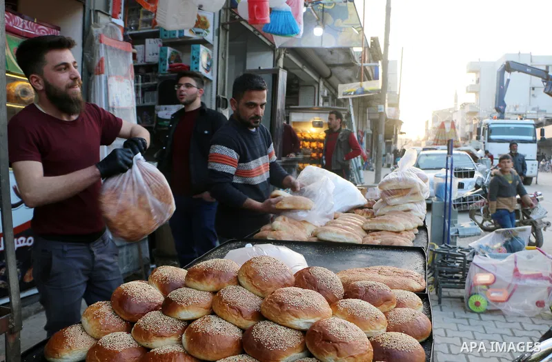 Syrians shop at a market ahead of Muslims holy fasting month Ramadan, in the city of Azaz, Syria on March 31, 2022. Photo by Samir Abed