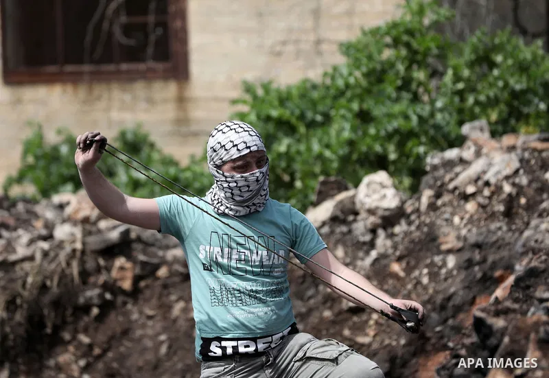 Palestinians demonstrating against the expropriation of land by Israel, clash with Israeli security forces in the village of Kfar Qaddum near the Jewish settlement of Kedumim in the West Bank, on April 1, 2022. Photo by...