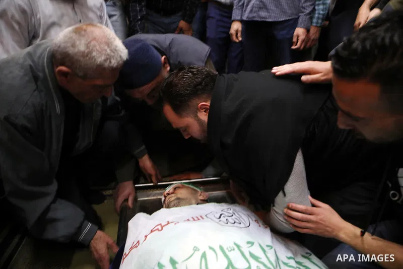 Mourners attend the funeral of Palestinian Ahmed Al-Atrash who killed by Israeli forces in the West Bank city of Hebron on April 1, 2022. Photo by Mamoun Wazwaz