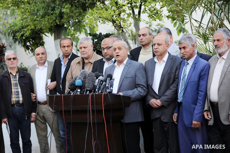 Members of Palestinian factions hold a joint a press conference following a meeting to discuss the heightened tension in the West Bank and Jerusalem on April 13, 2022 in Gaza city. Photo by Ashraf Amra