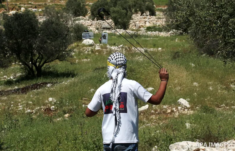 Palestinian protesters clash with Israeli security forces following a demonstration against the expropriation of land by Israel, in the village of Kfar Qaddum near the Jewish settlement of Kedumim in the West Bank, on Ap...