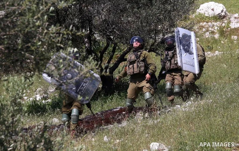 Palestinian protesters clash with Israeli security forces following a demonstration against the expropriation of land by Israel, in the village of Kfar Qaddum near the Jewish settlement of Kedumim in the West Bank, on Ap...