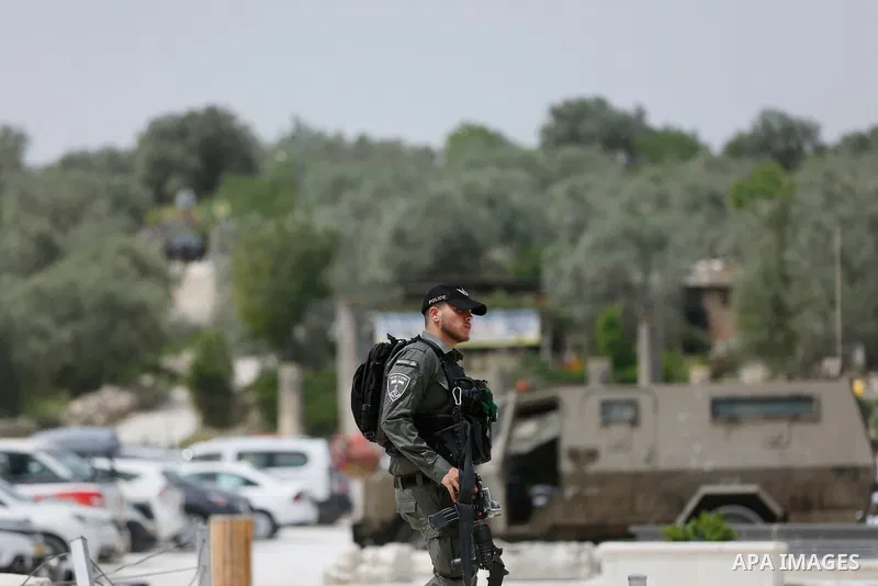 Israeli security forces take postion as Israeli Jewish settlers visitors are seen at an ancient Roman historical site as they celebrating the Jewish holiday of Passover, in the village of Sebastia, near the West Bank cit...