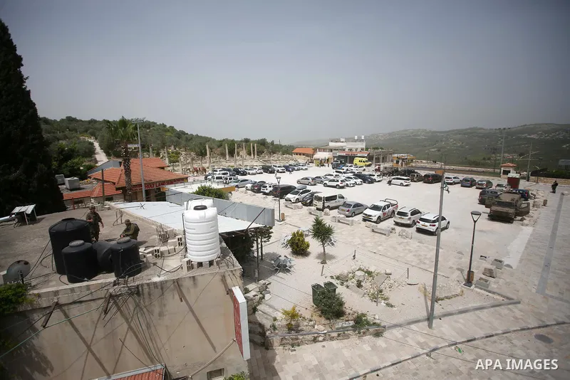 Israeli Jewish settlers visitors are seen at an ancient Roman historical site as they celebrating the Jewish holiday of Passover, in the village of Sebastia, near the West Bank city of Nablus, April 18, 2022. The ancient...