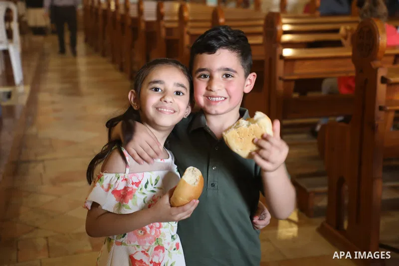 Christian Palestinians attend the Monday of the Angel mass (Feast of disciples of Jesus Simon and Cleopas) known as “Little Easter", in the monastery of the village of Al-Qubeiba northwest of Jerusalem, on April 18, 2022...