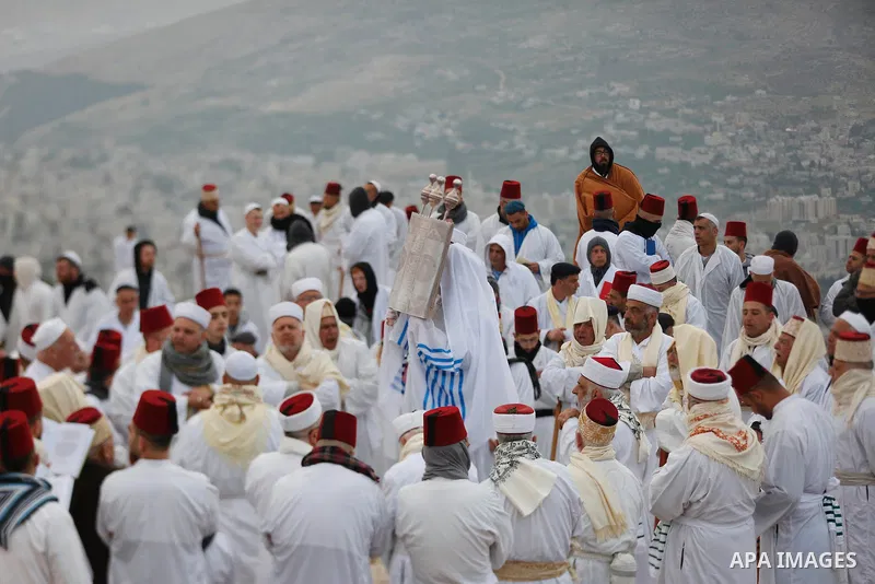 Samaritan worshippers arrive to take part in a Passover ceremony on top of Mount Gerizim, near the northern West Bank city of Nablus, early on April 21, 2022. The Samaritans are a community of a few hundred people living...