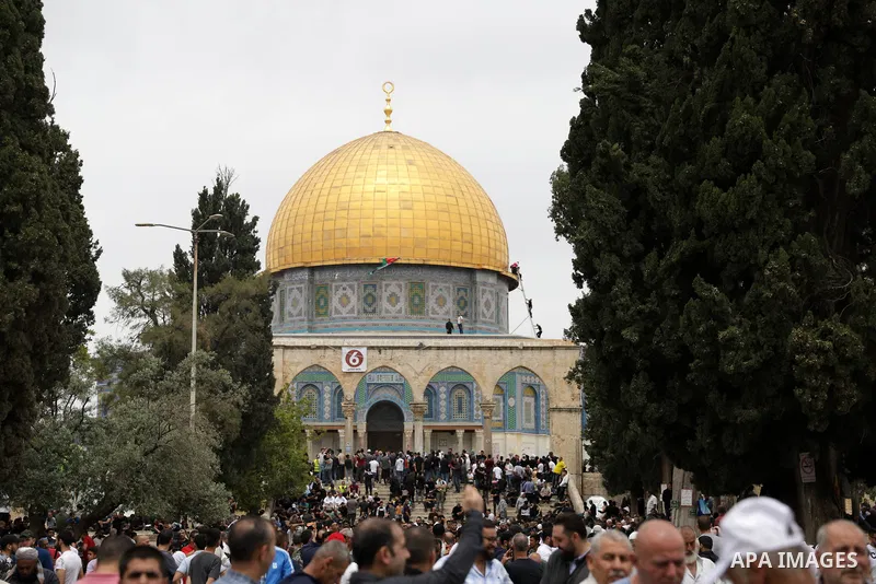 Palestinians perform Friday prayers, the third of the Muslim holy month of Ramadan, at Jerusalem's Al-Aqsa Mosque complex on April 22, 2022. Israeli police clashed again with Palestinian protesters at Jerusalem's flashpo...