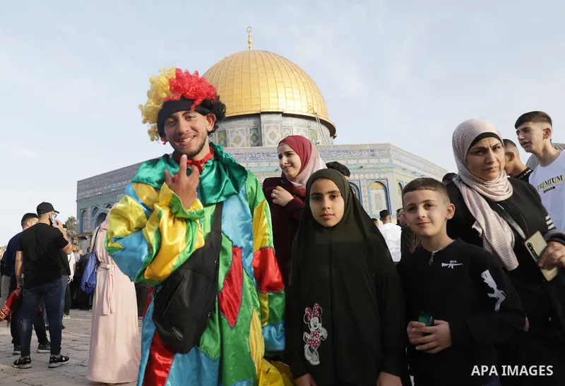 Palestinian Muslim worshipers perform the Eid al-Fitr prayer celebrating the end of the holy Muslim fasting month of Ramadan at the Al-Aqsa mosques compound in old Jerusalem on May 02, 2022. Photo by Jeries Bssier