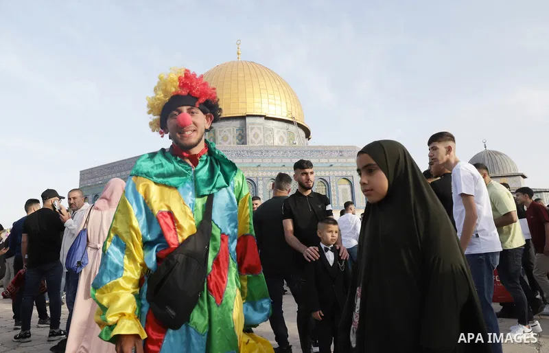 Palestinian Muslim worshipers perform the Eid al-Fitr prayer celebrating the end of the holy Muslim fasting month of Ramadan at the Al-Aqsa mosques compound in old Jerusalem on May 02, 2022. Photo by Jeries Bssier