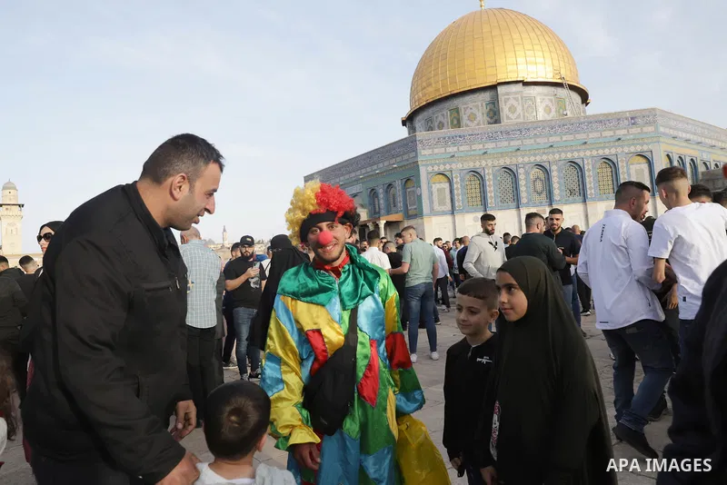 Palestinian Muslim worshipers perform the Eid al-Fitr prayer celebrating the end of the holy Muslim fasting month of Ramadan at the Al-Aqsa mosques compound in old Jerusalem on May 02, 2022. Photo by Jeries Bssier