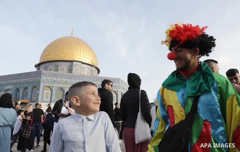 Palestinian Muslim worshipers perform the Eid al-Fitr prayer celebrating the end of the holy Muslim fasting month of Ramadan at the Al-Aqsa mosques compound in old Jerusalem on May 02, 2022. Photo by Jeries Bssier