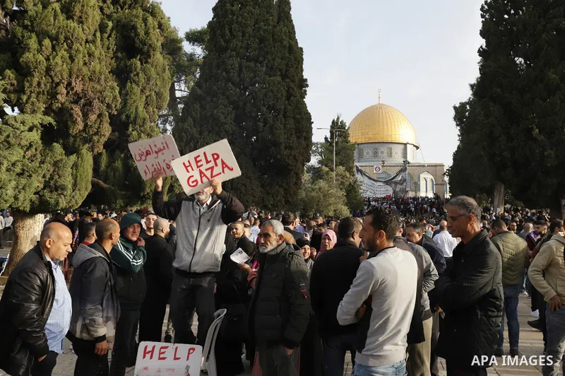 Palestinian Muslim worshipers perform the Eid al-Fitr prayer celebrating the end of the holy Muslim fasting month of Ramadan at the Al-Aqsa mosques compound in old Jerusalem on May 02, 2022. Photo by Jeries Bssier