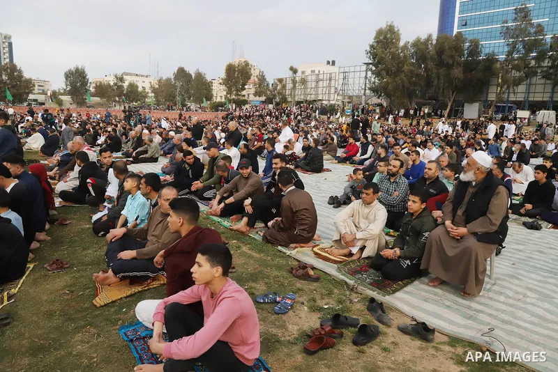 Palestinian Muslim worshipers perform the Eid al-Fitr prayer celebrating the end of the holy Muslim fasting month of Ramadan in Gaza city on May 02, 2022. Photo by Omar Ashtawy