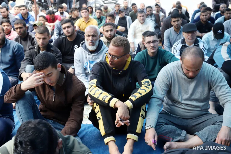 Palestinians attend Friday prayer in solidraity with prisoner on hunger strike since 64-day, in front of Red cross office, in Gaza city on May 6, 2022. A Palestinian under Israel's administrative detention was transferre...