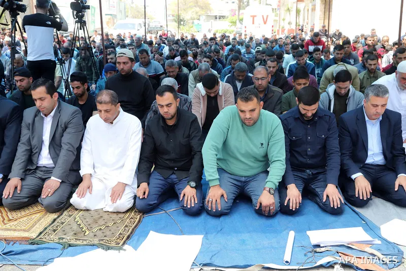 Palestinians attend Friday prayer in solidraity with prisoner on hunger strike since 64-day, in front of Red cross office, in Gaza city on May 6, 2022. A Palestinian under Israel's administrative detention was transferre...