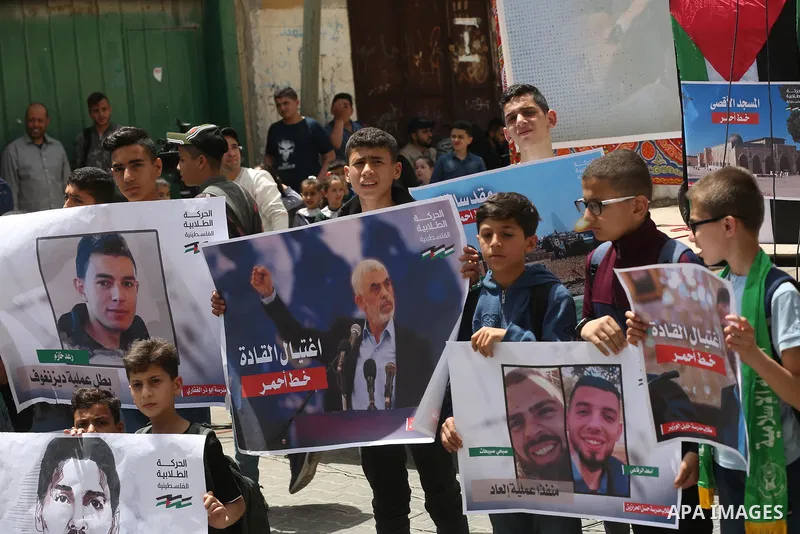 Palestinian students take part in a protest in support of Yahya Sinwar, Hamas' political chief, in front of his office in Gaza city, on May 9, 2022. Israeli officials have reportedly indirectly warned the leader of the H...