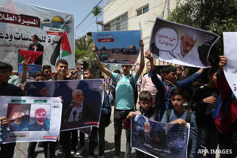 Palestinian students take part in a protest in support of Yahya Sinwar, Hamas' political chief, in front of his office in Gaza city, on May 9, 2022. Israeli officials have reportedly indirectly warned the leader of the H...