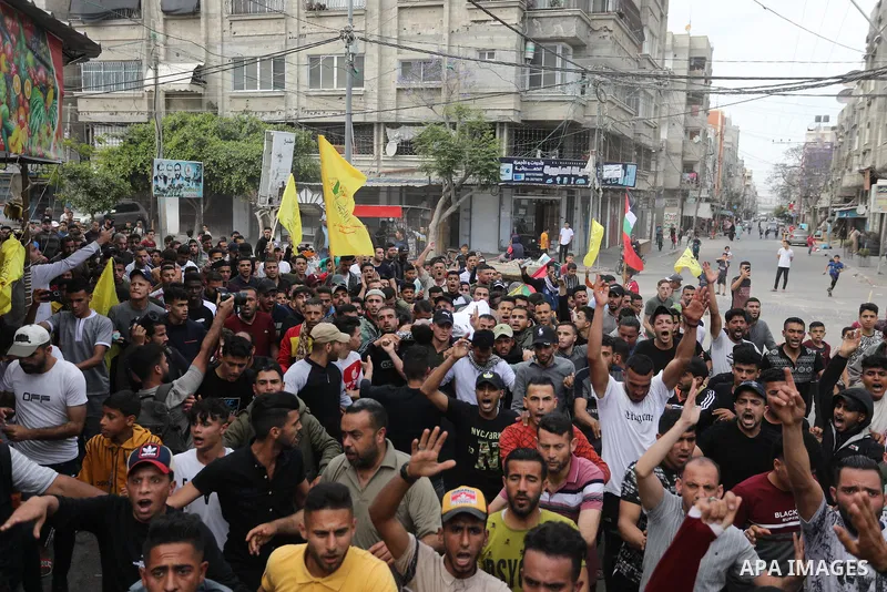 Mourners carry the body of Palestinian Mahmoud Aram who was shot killed by Israeli forces near a military checkpoint to the south of Tulkarem on Sunday, during his funeral in Khan Younis in the southern of Gaza strip, on...