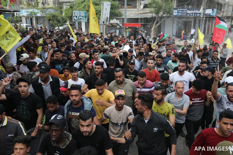 Mourners carry the body of Palestinian Mahmoud Aram who was shot killed by Israeli forces near a military checkpoint to the south of Tulkarem on Sunday, during his funeral in Khan Younis in the southern of Gaza strip, on...