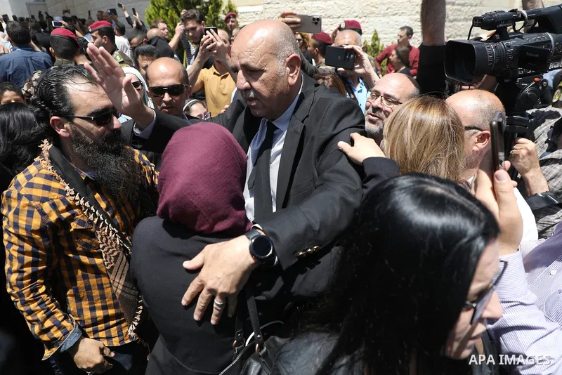 Walid Al-Omari, Al Jazeera's Palestine bureau Chief, bids farewell to Al Jazeera journalist Shireen Abu Akleh, who was killed during an Israeli raid, in the West Bank city of Ramallah on May 12, 2022. Photo by Wajed Noba...
