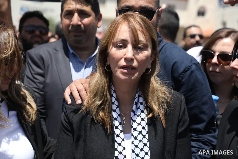 Al Jazeera journalist Guevara Al-Budairi bids farewell to Al Jazeera journalist Shireen Abu Akleh, who was killed during an Israeli raid, in the West Bank city of Ramallah on May 12, 2022. Photo by Wajed Nobani