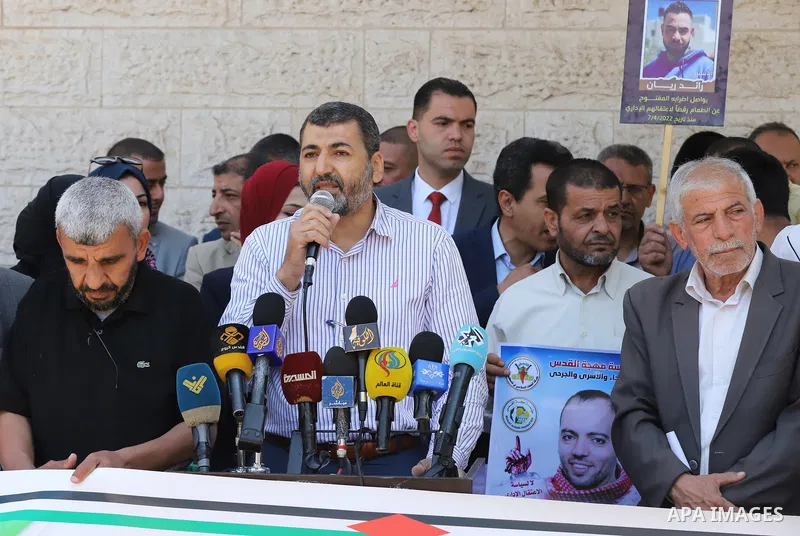 Palestinians take part in a protest in solidarity with prisoners in Israeli Jails in front of Red Cross office on May 17, 2022. More than 450 Palestinian detainees have been refusing to show up for their military court h...