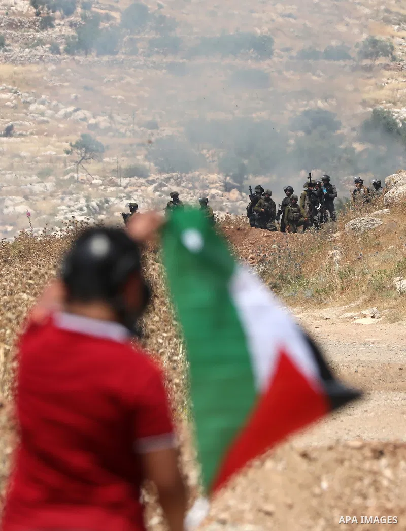 Palestinian protesters clash with Israeli forces following a protest against the expansion of Jewish settlements in the West Bank village of Beit Dajan on May 20, 2022. Photo by Stringer