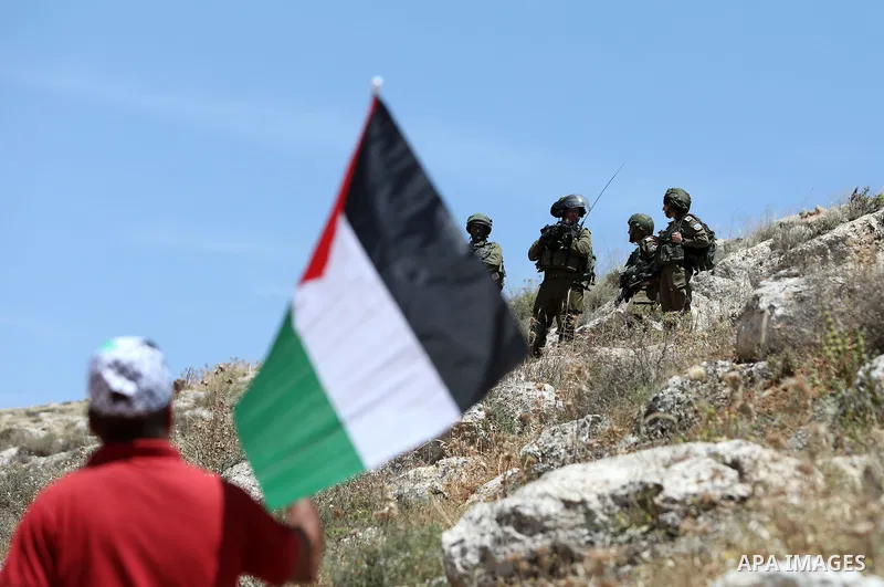 Palestinian protesters clash with Israeli forces following a protest against the expansion of Jewish settlements in the West Bank village of Beit Dajan on May 20, 2022. Photo by Stringer