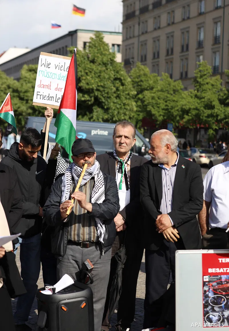 Foreign activists and Palestinians take part in a protest following the death of veteran Al Jazeera journalist Shireen Abu Aqleh, shot dead by Israeli troops as she covered a raid on the West Bank's Jenin refugee campin...