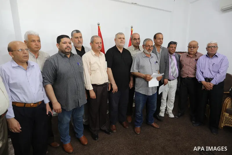 Palestinian members of the national and Islamic forces attend a press conference in Gaza city on May 31, 2022. Photo by Ashraf Amra