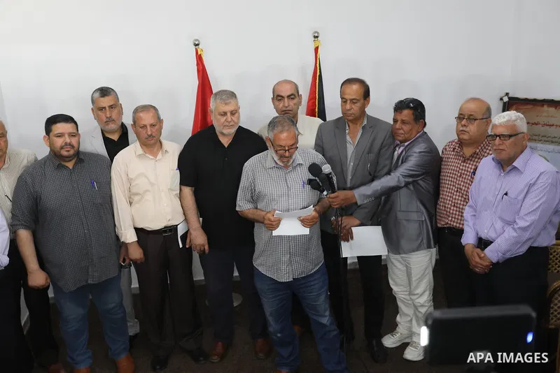 Palestinian members of the national and Islamic forces attend a press conference in Gaza city on May 31, 2022. Photo by Ashraf Amra