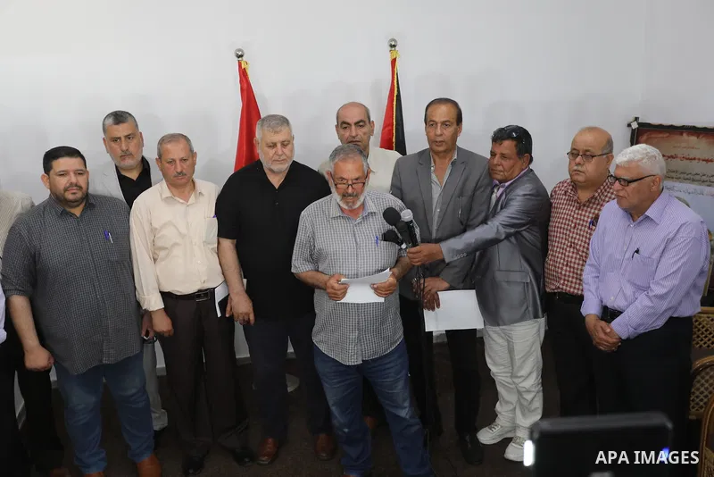 Palestinian members of the national and Islamic forces attend a press conference in Gaza city on May 31, 2022. Photo by Ashraf Amra