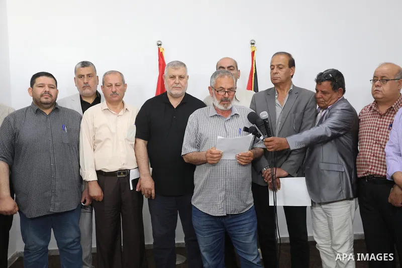 Palestinian members of the national and Islamic forces attend a press conference in Gaza city on May 31, 2022. Photo by Ashraf Amra