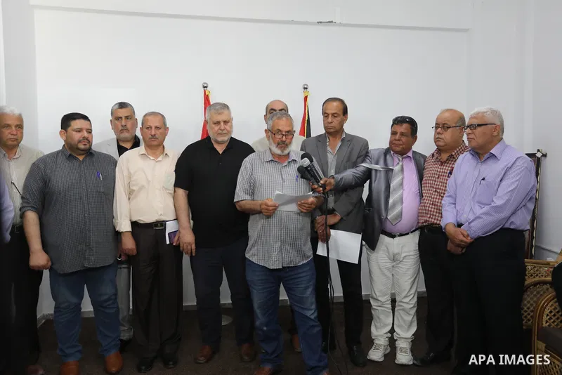 Palestinian members of the national and Islamic forces attend a press conference in Gaza city on May 31, 2022. Photo by Ashraf Amra