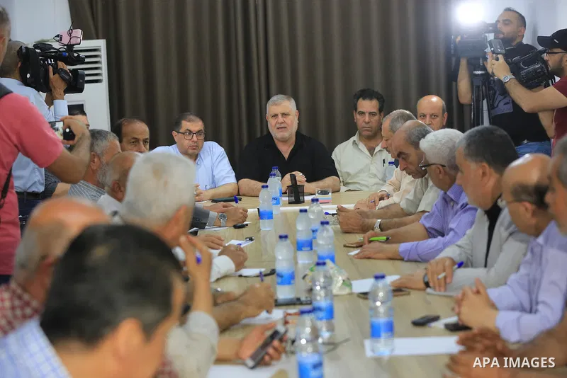 Palestinian members of the national and Islamic forces attend a meeting in Gaza city on May 31, 2022. Photo by Ashraf Amra