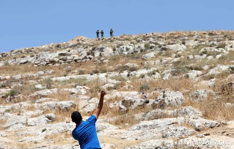 Palestinian protesters clash with Israeli forces during a demonstration against settlements in the village of Beit Dajan, near the West Bank city of Nablus on June 3, 2022. Photo by Stringer