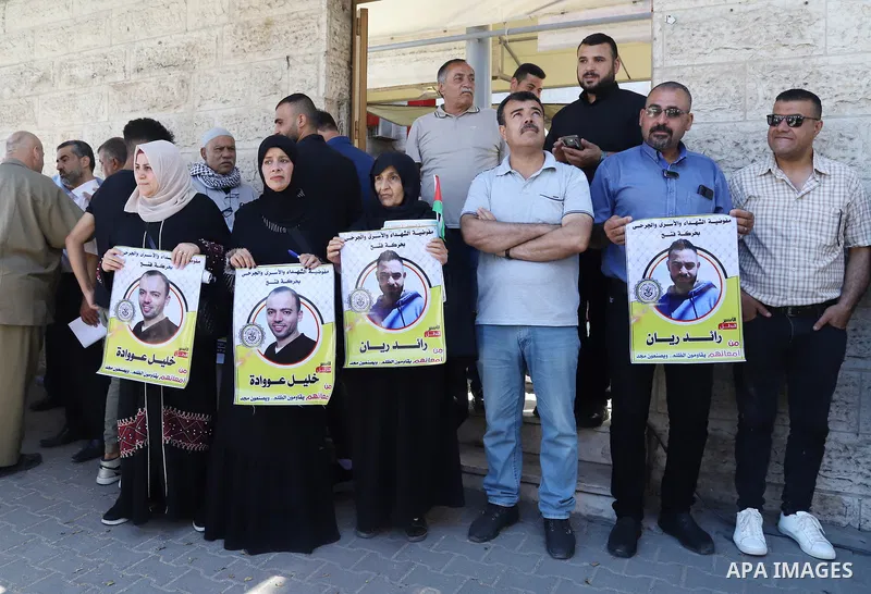 Palestinians take part in a protest in solidarity with prisoners on hunger strike in Israeli jails, in front of Red cross office in Gaza City on June 13, 2022. Two Palestinian administrative detainees in Israeli prisons...