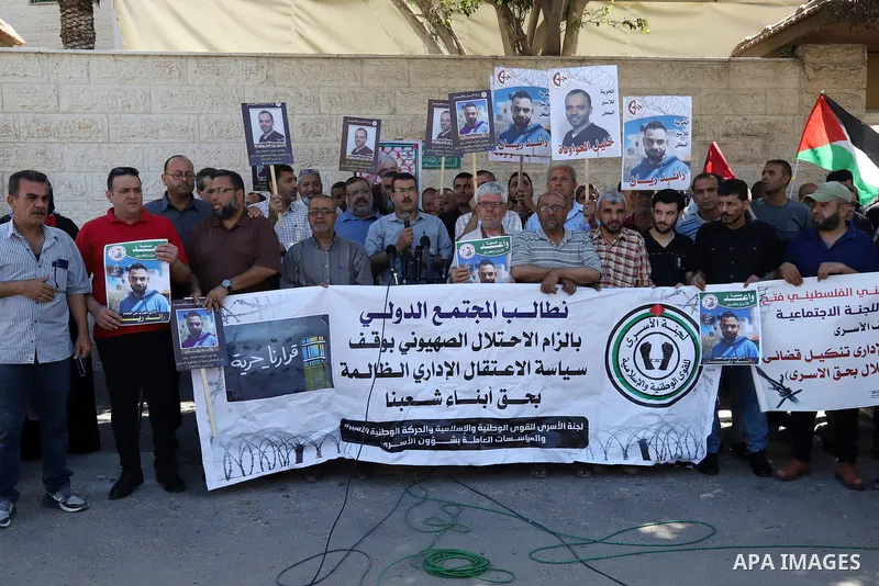 Palestinians take part in a protest in solidarity with prisoners on hunger strike in Israeli jails, in front of Red cross office in Gaza City on June 13, 2022. Two Palestinian administrative detainees in Israeli prisons...