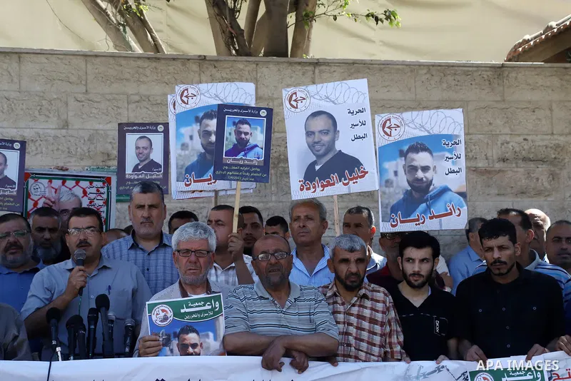 Palestinians take part in a protest in solidarity with prisoners on hunger strike in Israeli jails, in front of Red cross office in Gaza City on June 13, 2022. Two Palestinian administrative detainees in Israeli prisons...