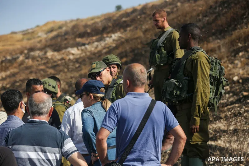 Israeli forces prevent a protest against settlement by Palestinian and foreign activists near outpost of Givat Ronen in Burin village, near the West Bank city of Nablus, on June 17, 2022. Photo by Shadi Jarar'ah